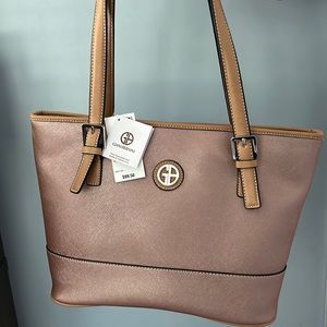 Purse from Giani Bernini. Never been used, still has tag on.